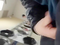 Guy plays with his cock in the laundry place